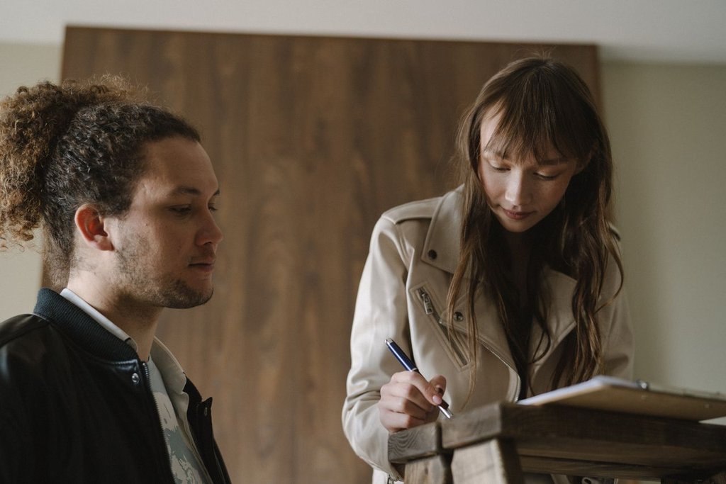 Expat couple reviewing a temporary rental contract in the Netherlands