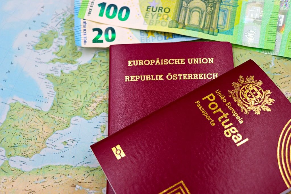 Euro banknotes and EU passports on a map, what you need to pay rent from abroad in the Netherlands